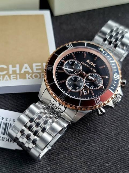 Michael Kors Men's Bayville 44x50mm watch features a black sunray dial with silver-tone stick indexes and numerals, chronograph movement and Steel bracelet.